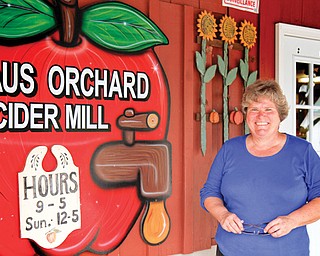 Cheryl Haus stands outside the company’s store. Haus and her husband, Matt, are owners of the business.