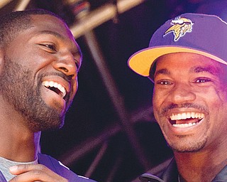 The Vikings’ Adrian Peterson, right, and Greg Jennings were instrumental in Minnesota’s 34-27 win over the Steelers on Sunday in London.