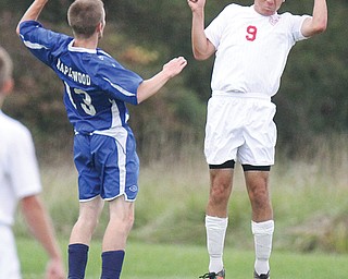 Lordstown’s Allen Martinko (9) heads the ball as Maplewood’s Gregory Tyler defends during Monday’s game in Lordstown.