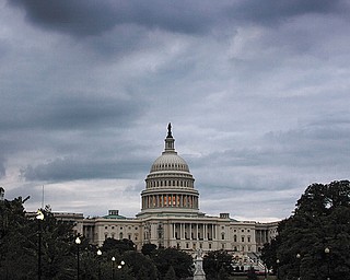 Storm clouds hang over Capitol Hill in Washington, Friday, Sept. 27, 2013.