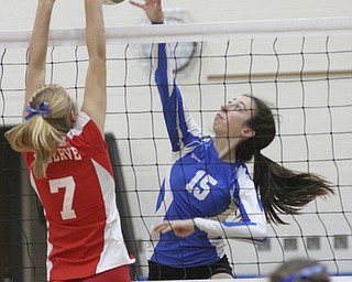 william D. Lewis The Vindicator Jax Milton's Sierra Huff(15) shoots past Western Reserve's Alexis Miller(7) during 10-2-13 action at Jax Milton.