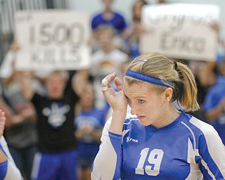 Erica Hughes of Jackson-Milton wipes her eyes after recording her 1,500th career volleyball kill during a home game against Western Reserve. The Bluejays fell to the Blue Devils, 3-0