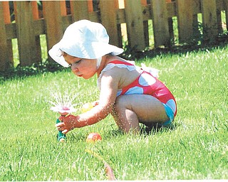 Natalie, daughter of Kristen and Dennis O'Hara of Youngstown, is having fun with her flower sprinkler. Sent by Grandma Lynne Drabison of Youngstown.
