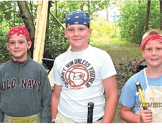 Grandsons Cain, Cody and Kyle Palovich, are preparing to help their dad and grandpa build a tree house at their home in Chardon. Sent by Grandmother Benita Palovich.