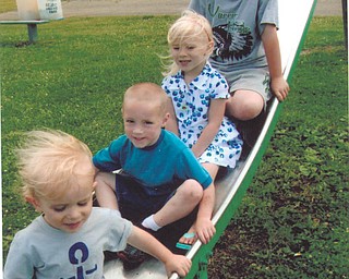 Colleen Close of Beloit took this photo of her grandchildren, from top to bottom, Carter, Lilah, Austin and Josiah Close, on the slide at Beloit Park.