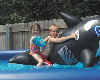 From Tina Buzzelli: Her son, Christopher Buzzelli of Mineral Ridge, and niece, Hailey Tomory of Canfield, are enjoying their ride on a shark five years ago!