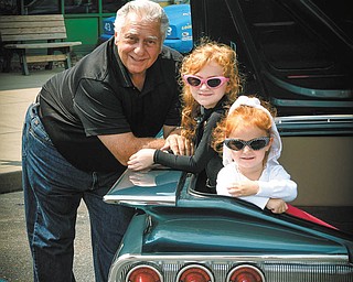 Lauren and Claire O’Leary of Youngstown perch in Papa Butch’s 60 Chevy with proud Papa, Bob Chicone of McDonald, supervising.