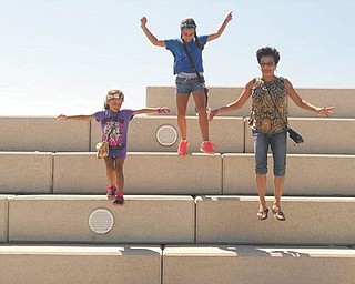 Aliya and Amaya Abeid of New Middletown are having fun at Voinovich Park in Cleveland with their Aunt Evelyn Filipkowski of Cleveland.