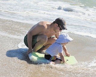 Patrick Manning is showing his son, Sam, how to use a Boogie board at Bethany Beach, Del. Taken by Sam's grandmother, Joyce Buzzacco.