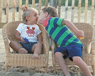 "Kissing cousins" Sam Manning, 3, and Nina Armeni, 16 months, at Bethany Beach, Del. Taken by Sam"s grandmother, Joyce Buzzacco.