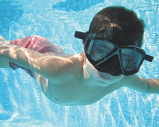 Alex Jorge, 7, of Struthers, is caught swimming under water by his mom, Elizabeth Jorge.