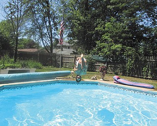 A front view as Joe Zordich does a flip into the pool, taken by his mother, Laura Brown.
