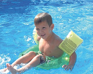 Xavier Nelson riding the waves in Grandma and Pap's pool. Sent by Kathy Mackall of Columbiana.