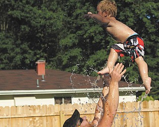 Two-year old Ben Gaither cools off in the family pool and has complete confidence that his dad will catch him. Ben is the son of Becky and Bill Gaither of Austintown. Sent by Ben's grandma, Laurie Fox.
