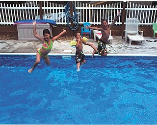Trystin, Xavier and Chase Nelson, ready and set to go in their grandma and grandpa's pool. Sent by Kathy Mackall of Columbiana.