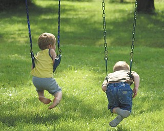 Two-year old cousins, Cameron Mason and Ben Gaither, enjoy a hot summer day swinging at the home of grandparents Mike and Laurie Fox in Lowellville. Cameron is the son of Beth and Matt Mason of Salem, and Ben is the son of Becky and Bill Gaither of Austintown. Sent by grandma.