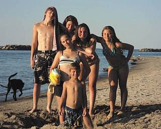 Cousins Emilee, Jessi and Evan Urichich of Dayton and Katelyn, Derek and Alexis of Niles have fun at Lake Erie. Sent by their grandmother.