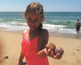 Lilyanah Miller is proud of her new found shells at Nantucket Island.