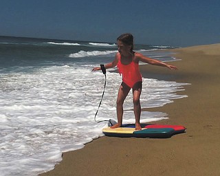 Lilyanah Miller prepares and wonders when and if the water will carry her out to sea!