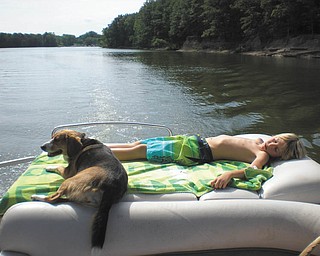 Andrew Knotten of Boardman and his dog, Teeney, are enjoying a relaxing afternoon on Berlin Lake late in August. Taken by his mom, Carol Knotten.