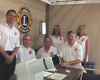 SPECIAL TO THE VINDICATOR
The Youngstown Lions Club provided eye screenings for more than 600 people at the Canfield Fair this year. More than 100 of those were encouraged to visit their physicians for follow-up care. In the past, one woman who had the screening was told to visit her doctor and a tumor was found and treated successfully. Some of those who volunteered, from left, are Bill Ruggles and Justin Kuhn of Austintown; Adam Costello of Youngstown,
vice president; Pat Nichols of Liberty; Brian Hughes of Boardman; and Nancy Cuffle of Poland, president.
