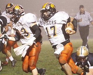 . ROBERT K. YOSAY | THE VINDICATOR..Wellsville #17 Jordan Sloan follows #23 Zack Mellot as he rambles into the TD at Lowellville