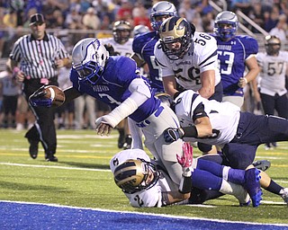 William D Lewis the Vindicator Hubbard's LJ SCott(3) dives into the endzone for a 1rst qtr TD Friday 10-4. He is pursued by Brookfield's Mark Kraml (2) Brian Hiner (6) and Tom Wike(56).