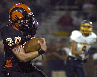 Kelli Cardinal/The Vindicator .Mineral Ridge running back Josh Goss carries the ball down the field Friday against McDonald at Whittaker Field.