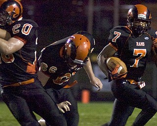 Kelli Cardinal/The Vindicator .Mineral Ridge senior Corey Phillips carries the ball Friday against McDonald at Whittaker Field.