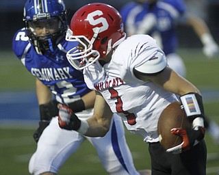 . ROBERT K. YOSAY | THE VINDICATOR..Poland #12 Tyler Smith hones in on Struthers #3 Dalton Moore after Dalton picked up a first down in the first quarter...Poland vs Struthers @ Poland