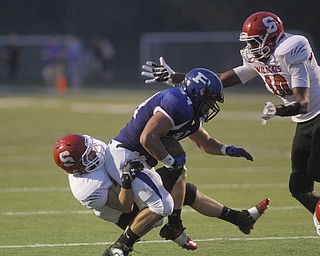 . ROBERT K. YOSAY | THE VINDICATOR..Polands #44 Jake Aiello finally gets stopped by Struthers #28 Anthony Farkas and #10 Temeko Holness of Struthers - during first quarter action..Poland vs Struthers @ Poland