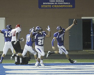 . ROBERT K. YOSAY | THE VINDICATOR..Polands #5 Jacob Wolfe -qb on the keeper celebrates as he goes 61 yards for a TD with him is polands #28 Marion Ramirez ..Poland vs Struthers @ Poland