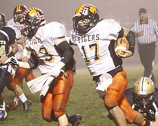 . ROBERT K. YOSAY | THE VINDICATOR..Wellsville #17 Jordan Sloan follows #23 Zack Mellot as he rambles into the TD at Lowellville