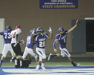 . ROBERT K. YOSAY | THE VINDICATOR..Polands #5 Jacob Wolfe -qb on the keeper celebrates as he goes 61 yards for a TD with him is polands #28 Marion Ramirez ..Poland vs Struthers @ Poland