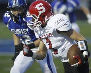 . ROBERT K. YOSAY | THE VINDICATOR..Poland #12 Tyler Smith hones in on Struthers #3 Dalton Moore after Dalton picked up a first down in the first quarter...Poland vs Struthers @ Poland