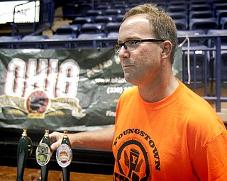 MADELYN P. HASTINGS | THE VINDICATOR..Tom Smith talks with a customer about the Ohio Brewing Company out of Akron during the Beer Fest at the Covelli Center on Saturday, October 5, 2013. ... - -30-..