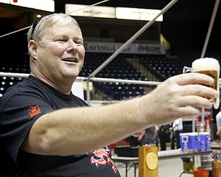 MADELYN P. HASTINGS | THE VINDICATOR..Tim Beauchamp of Boardman pours a Kentucky Bourbon Barrel Ale for a customer at the Beer Fest at the Covelli Center on Saturday, October 5, 2013. ... - -30-..