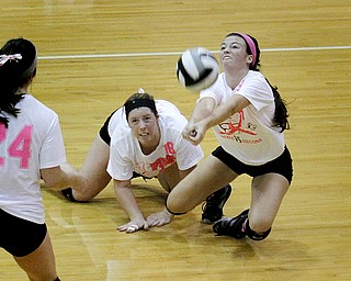MADELYN P. HASTINGS | THE VINDICATOR..(L-R) Boardman's Faith Saunders (18) and Krista Johnson (13) fall for the ball during their game against Fitch at Boardman High School on Saturday, October 5, 2013. Boardman went on to win three consecutive games. .... - -30-..