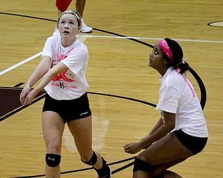 MADELYN P. HASTINGS | THE VINDICATOR..Boardman's Megan Volosin (4) bumps the ball while Brittany Pruitt (11) covers her during their game against Fitch at Boardman High School on Saturday, October 5, 2013. Boardman won three consecutive games. ... - -30-..