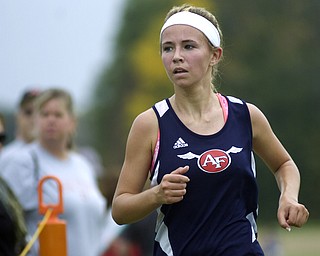 Kelli Cardinal/The Vindicator .Carissa Jenkins, a senior from Austintown Fitch, nears the finish line Saturday in the girls Division I race during the Legends Cross Country Meet at Trumbull County Fairgrounds.