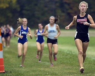 Kelli Cardinal/The Vindicator .Raquel Markulin, a freshman from Canfield, stays ahead of the pack Saturday in the girls Division I race during the Legends Cross Country Meet at Trumbull County Fairgrounds.