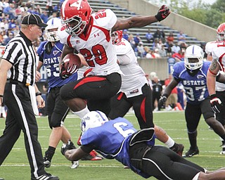 Youngstown State's Martin Ruiz (29) leaps over Indiana State's Othniel Harvey (6) on his way to scoring his second touchdown of the night during the second quarter of Saturday nights matchup at Indiana State University in Terre Haute, Indiana. Dustin Livesay | The Vindicator 10/05/13 Indiana State University.