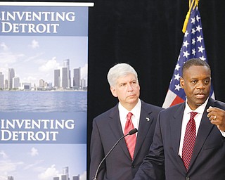 State-appointed emergency manager Kevyn Orr, right, and Michigan Gov. Rick Snyder address reporters during a news conference in Detroit after Orr asked a federal judge for bankruptcy protection. Though no other city is expected to join Detroit in bankruptcy court anytime soon, Detroit’s bankruptcy is casting a shadow over a long list of cities across the U.S. and giving mayors new urgency in the search for solutions to the greatest challenge to face America’s cities in a generation.