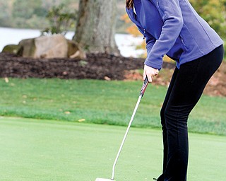 Poland senior Melinda Hannon practices her putting during Monday’s practice at the Lake Club. Hannon will compete in the Division II state golf meet this weekend in Columbus.