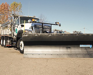 A tow plow is attached to an Ohio Department of Transportation truck as ODOT District 4 unveiled it Wednesday at the Mahoning County garage in Canfield. The tow plow is capable of clearing right and left lanes of roadways simultaneously.