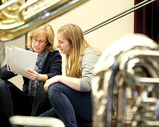 From left Beth and Laura Fox review some of the programs offered at Youngstown State University’s Dana School of Music in the Wind Ensemble class. Laura is a senior at North Allegheny High School in Pittsburgh. Students considering attending Dana had the opportunity Wednesday to experience a day at the school, meeting professors and current students and sitting in on rehearsals.