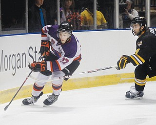 Phantoms forward Tyler Spezia (17) eludes Green Bay’s Kevin Irwin (14) during their Sept. 28 game at the Covelli Centre.