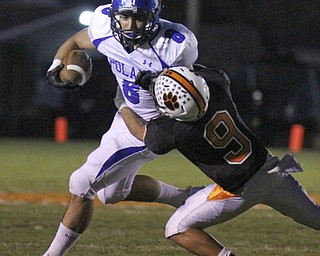 William d. Lewis The Vindicator Poland's (8) eludes Howland defender (9) during 10-11-13 game at Howland.