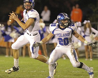 William d. Lewis The Vindicator Poland QB Jacob Wolfe (5) and Ross Gould (20)during 10-11-13 game at Howland.