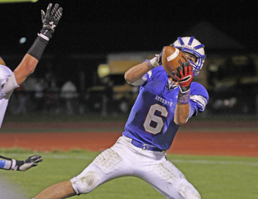  .          ROBERT  K. YOSAY | THE VINDICATOR..Wester Reserve #6  John Clegg takes in a pass to the three yard line during third quarter action and WR scored on the next play..Lowellville at Western Reserver